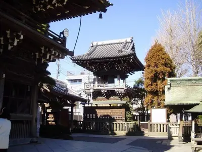 a building with a tower in the middle of a street at Sky Heart Hotel Koiwa - Vacation STAY 49085v in Tokyo