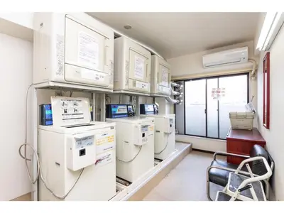 a hospital room with machines and a chair in it at Sky Heart Hotel Koiwa - Vacation STAY 49103v in Tokyo