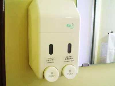 a digital clock on a wall next to a mirror at Sky Heart Hotel Koiwa - Vacation STAY 49103v in Tokyo