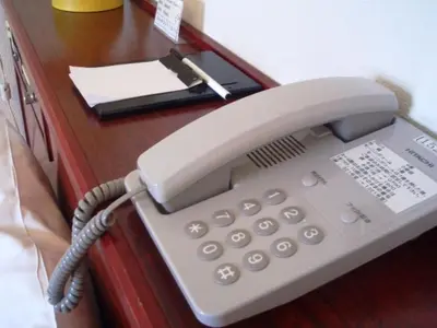 a phone sitting on top of a desk at Sky Heart Hotel Koiwa - Vacation STAY 49100v in Tokyo