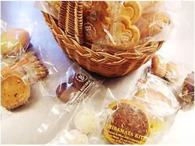 a basket of pastries and cookies in plastic bags at Sky Heart Hotel Koiwa - Vacation STAY 49100v in Tokyo