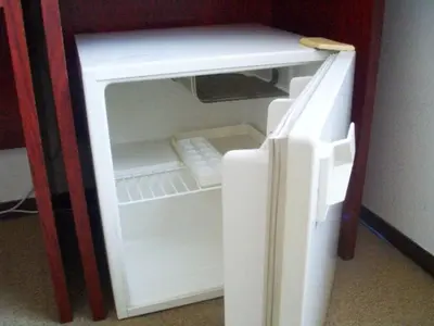 an empty refrigerator with its door open in a room at Sky Heart Hotel Koiwa - Vacation STAY 49094v in Tokyo