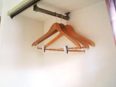 a group of wooden hangers hanging on a wall at Sky Heart Hotel Koiwa - Vacation STAY 49094v in Tokyo