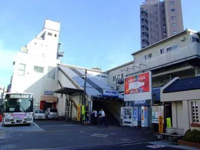 a bus is parked in front of a building at Sky Heart Hotel Koiwa - Vacation STAY 49106v in Tokyo