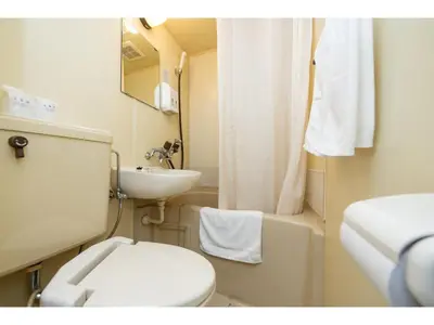 a small bathroom with a toilet and a sink at Sky Heart Hotel Koiwa - Vacation STAY 49106v in Tokyo