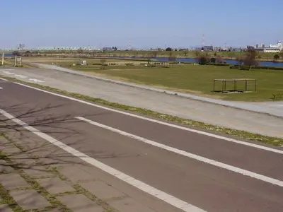 an empty road next to a field of grass at Sky Heart Hotel Koiwa - Vacation STAY 49104v in Tokyo