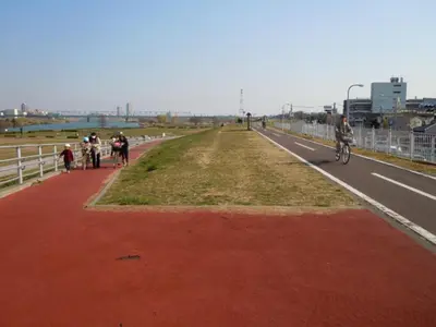 a group of people riding bikes on a road at Sky Heart Hotel Koiwa - Vacation STAY 49104v in Tokyo
