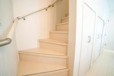 a stairwell in a house with wooden stairs at Skytree view Oshiage in Tokyo