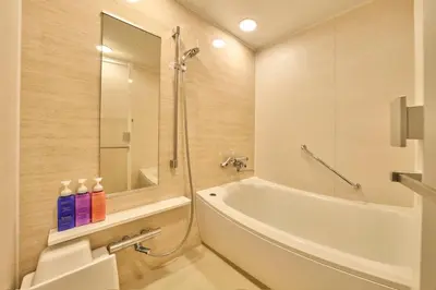 a bathroom with a tub and a toilet and a sink at Keisei Richmond Hotel Tokyo Kinshicho in Tokyo