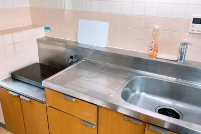 a kitchen counter with a stainless steel sink at Esperanza 303\u53f7\u5ba4 in Tokyo