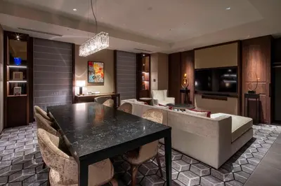 a dining room with a black table and chairs at Hotel GrandBach Tokyo Ginza in Tokyo