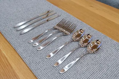 a group of silver utensils sitting on a table at Ostay Ikebukuro Dairaku Hotel Apartment in Tokyo