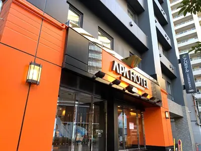 an orange building with a nordstrom sign on it at APA Hotel Keikyu Kamata Ekimae Nishi in Tokyo