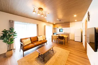 a living room with a couch and a table at GIVE Shibuya Honmachi in Tokyo