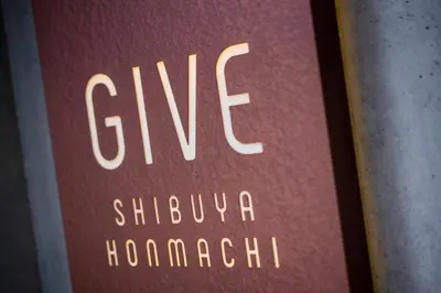 a book with the words give shubuhahahahahahaha at GIVE Shibuya Honmachi in Tokyo