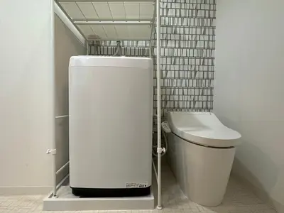 a small bathroom with a toilet and a sink at nestay inn tokyo ryogoku in Tokyo