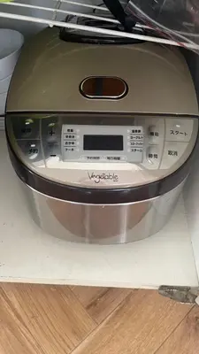 a front view of a washing machine on a floor at Hotel Futaba Heights -\u30d5\u30bf\u30d0\u30cf\u30a4\u30c4- in Tokyo