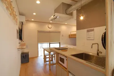 a kitchen with a sink and a counter top at Hotel Futaba Heights -\u30d5\u30bf\u30d0\u30cf\u30a4\u30c4- in Tokyo