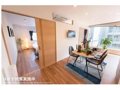 a dining room with a table and chairs in a room at Tora Hotel Skytree - Vacation STAY 51803v in Tokyo