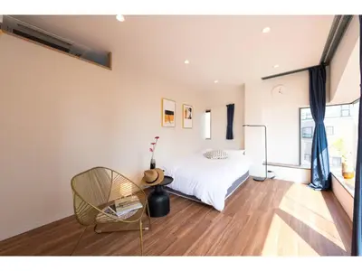 a bedroom with a white bed and a chair at Tora Hotel Skytree - Vacation STAY 51803v in Tokyo