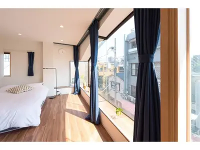 a bedroom with a bed and a large window at Tora Hotel Skytree - Vacation STAY 51803v in Tokyo