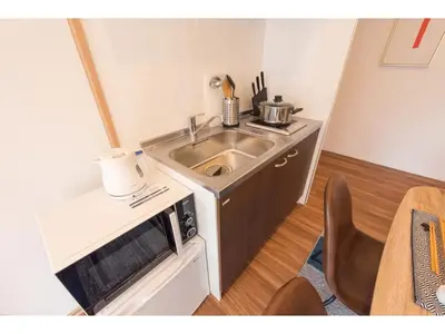 a small kitchen with a sink and a microwave at Tora Hotel Skytree - Vacation STAY 51803v in Tokyo