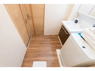 a small bathroom with a sink and a washing machine at Tora Hotel Skytree - Vacation STAY 51803v in Tokyo