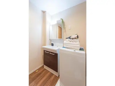 a small bathroom with a sink and a refrigerator at Tora Hotel Skytree - Vacation STAY 51803v in Tokyo