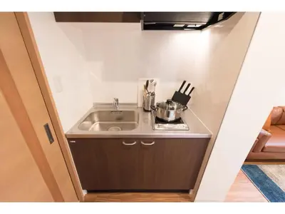 a small kitchen with a sink in a room at Tora Hotel Skytree - Vacation STAY 51801v in Tokyo