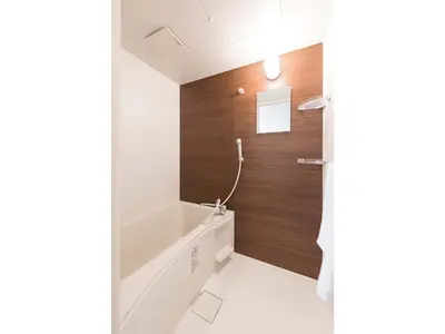 a bathroom with a sink and wooden wall at Tora Hotel Skytree - Vacation STAY 51801v in Tokyo