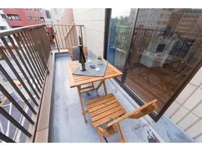 a table and a chair on a balcony at Tora Hotel Skytree - Vacation STAY 51807v in Tokyo