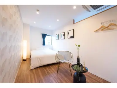 a bedroom with a bed and a chair in it at Tora Hotel Skytree - Vacation STAY 51807v in Tokyo