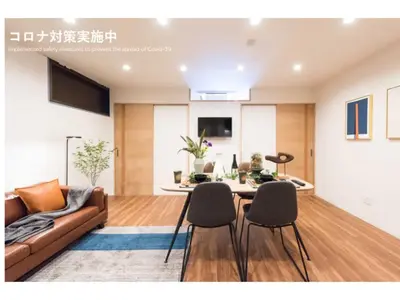 a living room with a couch and a table and chairs at Tora Hotel Skytree - Vacation STAY 51806v in Tokyo