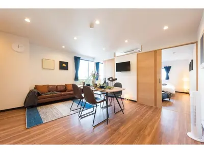 a living room with a table and a couch at Tora Hotel Skytree - Vacation STAY 51816v in Tokyo