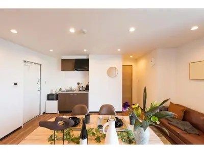 a dining room and living room with a table and chairs at Tora Hotel Skytree - Vacation STAY 51816v in Tokyo