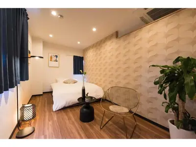 a bedroom with a bed and a table and chairs at Tora Hotel Skytree - Vacation STAY 51816v in Tokyo