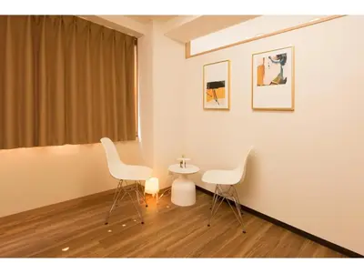 two white chairs and a table in a room at Tora Hotel Rikugien - Vacation STAY 52738v in Tokyo
