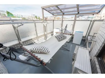 a balcony with two benches on a boat at Tora Hotel Rikugien - Vacation STAY 52744v in Tokyo