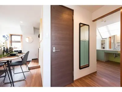 a wooden door in a living room with a table at Tora Hotel Rikugien - Vacation STAY 52744v in Tokyo