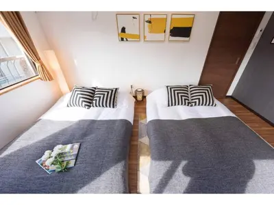 two beds in a small room with at Tora Hotel Rikugien - Vacation STAY 52744v in Tokyo