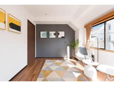 a living room with a table and a chair at Tora Hotel Rikugien - Vacation STAY 52744v in Tokyo