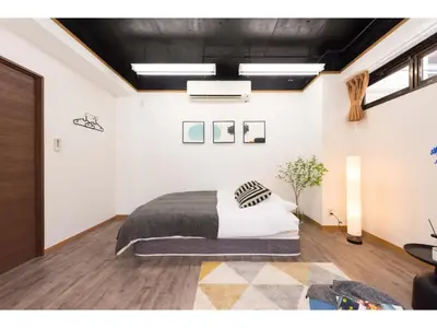 a bedroom with a large bed in a room at Tora Hotel Rikugien - Vacation STAY 52726v in Tokyo