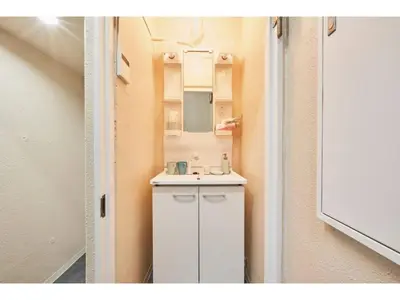 a small bathroom with a sink and a mirror at Tora Hotel Kitaueno - Vacation STAY 52747v in Tokyo