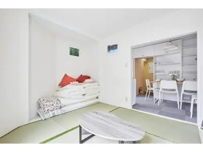 a living room with a couch and a table at Tora Hotel Kitaueno - Vacation STAY 52747v in Tokyo