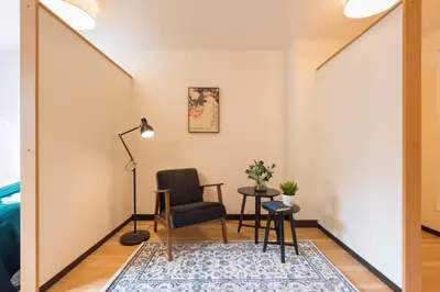 a living room with a chair and a table at Tora Hotel Ueno - Vacation STAY 52809v in Tokyo