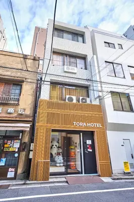 a store front of a toronto hotel on a city street at Tora Hotel Ueno - Vacation STAY 52809v in Tokyo