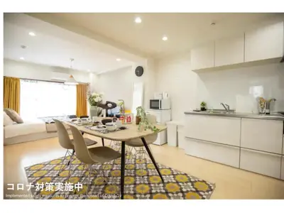 a kitchen with a table and chairs in a room at Tora Hotel Taito - Vacation STAY 53059v in Tokyo