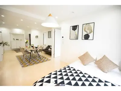 a bedroom with a bed and a table in a room at Tora Hotel Taito - Vacation STAY 53059v in Tokyo