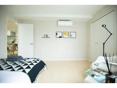 a white room with a bed and a chair at Tora Hotel Taito - Vacation STAY 53059v in Tokyo