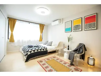 a bedroom with a bed and a window and a rug at Tora Hotel Taito - Vacation STAY 53059v in Tokyo